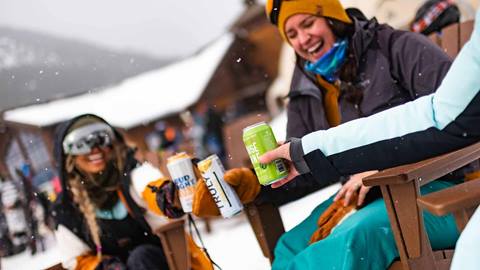 Skiers enjoying the base area at Crystal