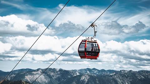 Gondola cabin with clouds in the background